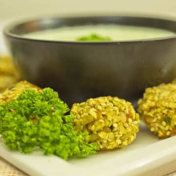 Turmeric Veggie Rice Balls with Sesame Seeds - A tasty gluten free appetizer or healthy snack for kids, can easily go into lunchboxes. Gluten Free & Dairy Free.