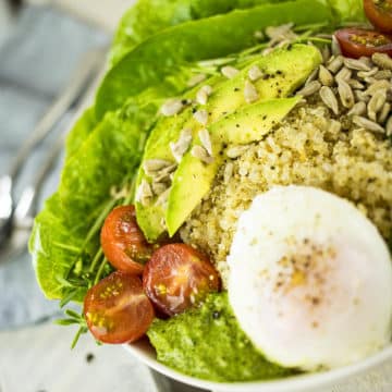 Quinoa Breakfast Bowl with Poached Egg, Avocado & Pesto. A delicious gluten free breakfast that will get you going for the day! Gluten Free, Dairy Free, Vegetarian.