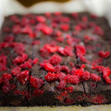 Close up of chocolate raspberry brownies in baking tray