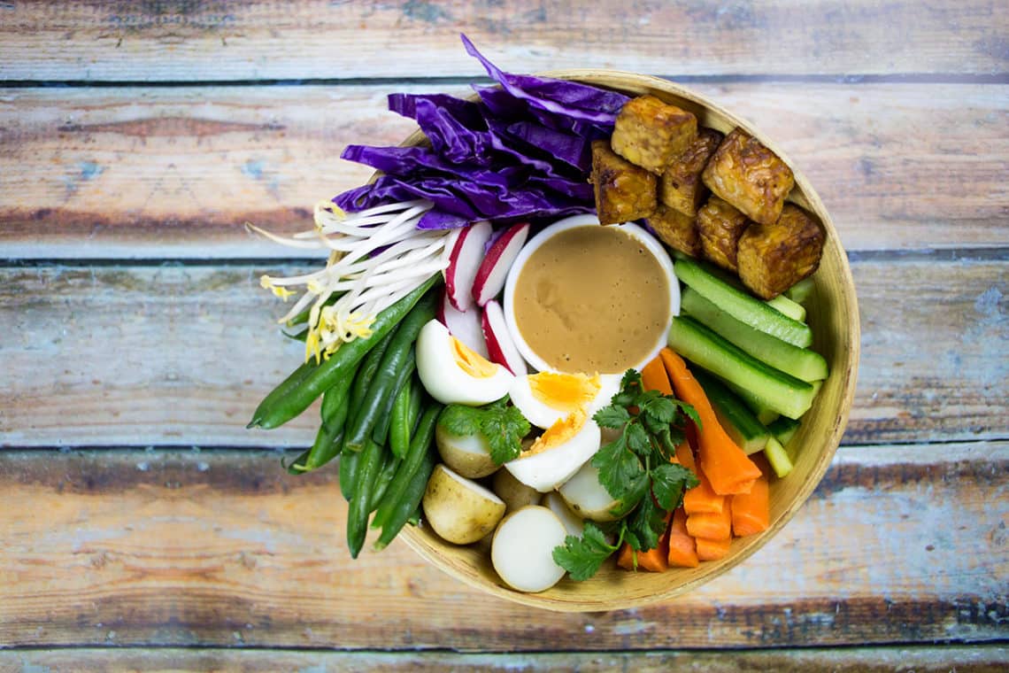 Gado Gado Indonesian Salad on wooden background.