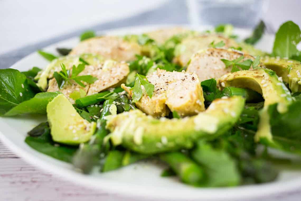 Chicken & Avocado Salad close up with glass of water