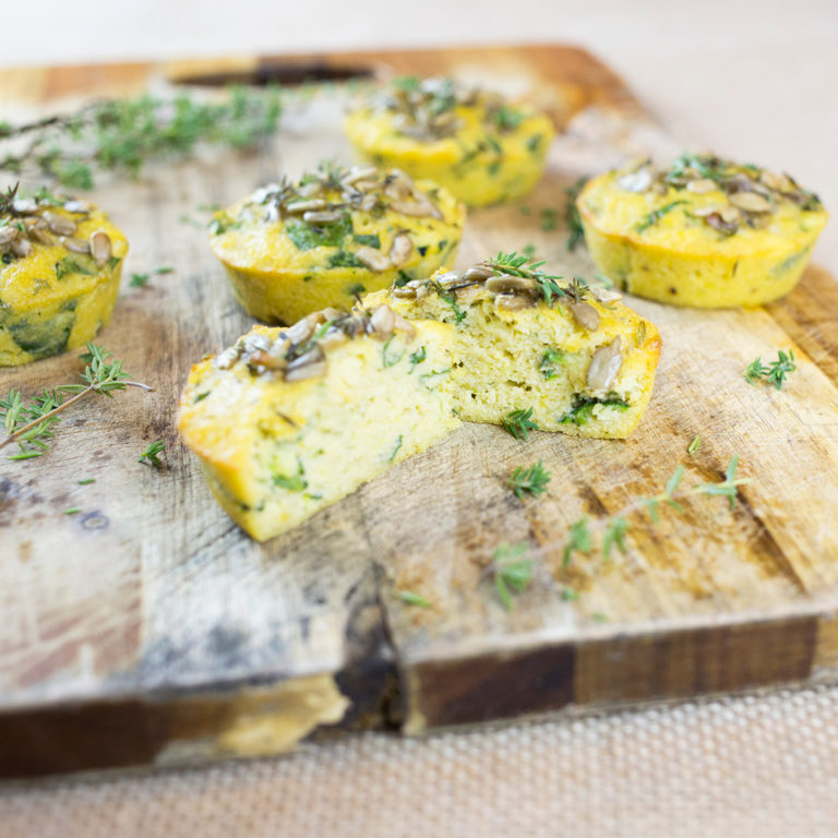 Gluten free savoury muffins on chopping board cut in half