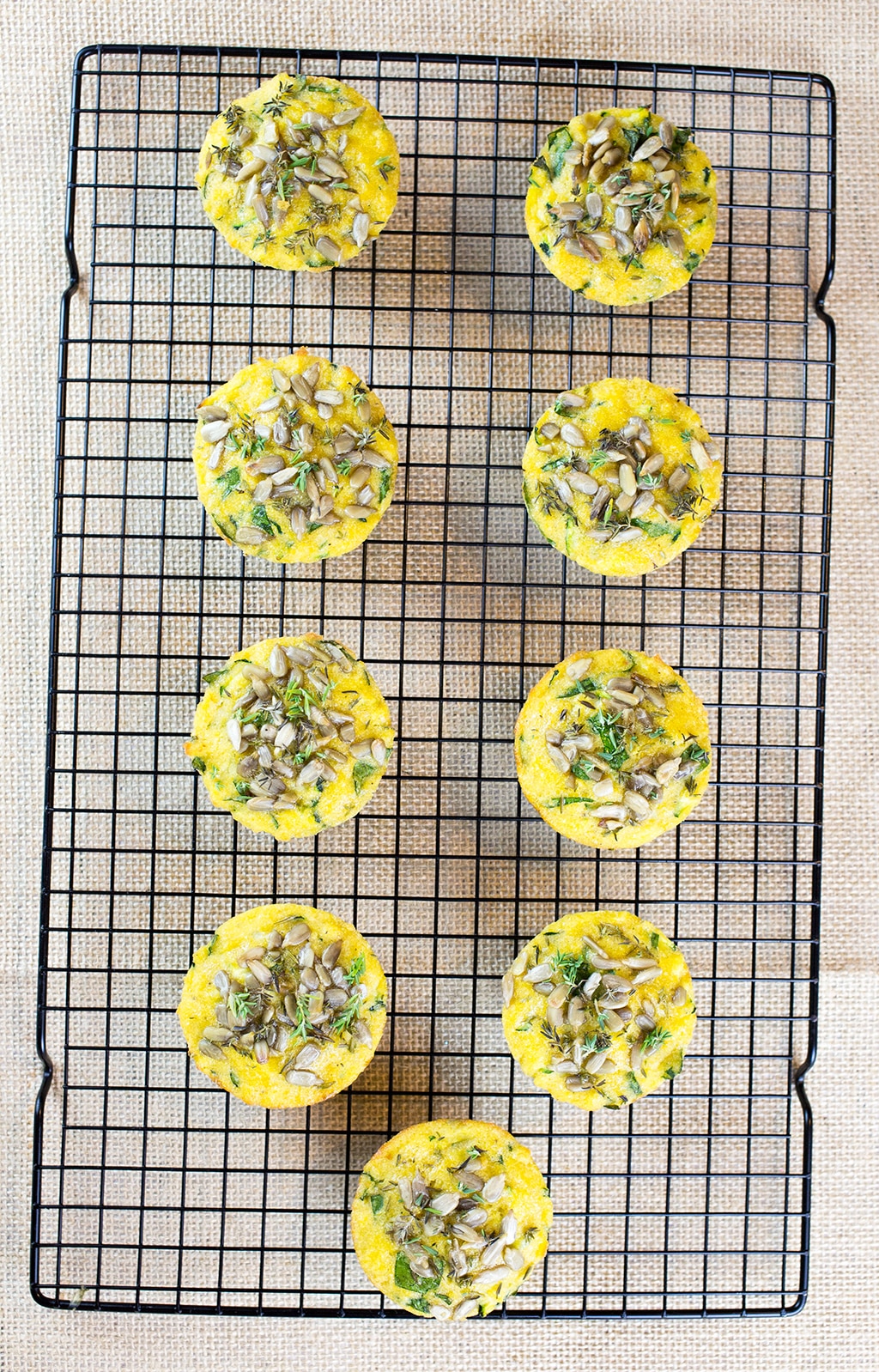 Birdseye view of gluten free savoury muffins on baking tray.