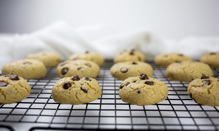 Gluten-free dairy-free chocolate chip cookies on baking tray.