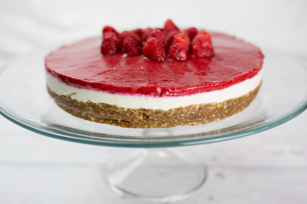This creamy vegan raspberry cheesecake makes a delightful fresh and fruity dessert and requires no baking. Smooth, creamy, with the right balance of tart and sweet from the raspberries, this dessert is a real crowd pleaser. This raspberry cheesecake is vegan, gluten free, dairy free and paleo.#paleorecipes #vegancheesecake #raspberries #raspberrycheesecake #vegandessert #dairyfree #glutenfreedessert #lowcarbdessert