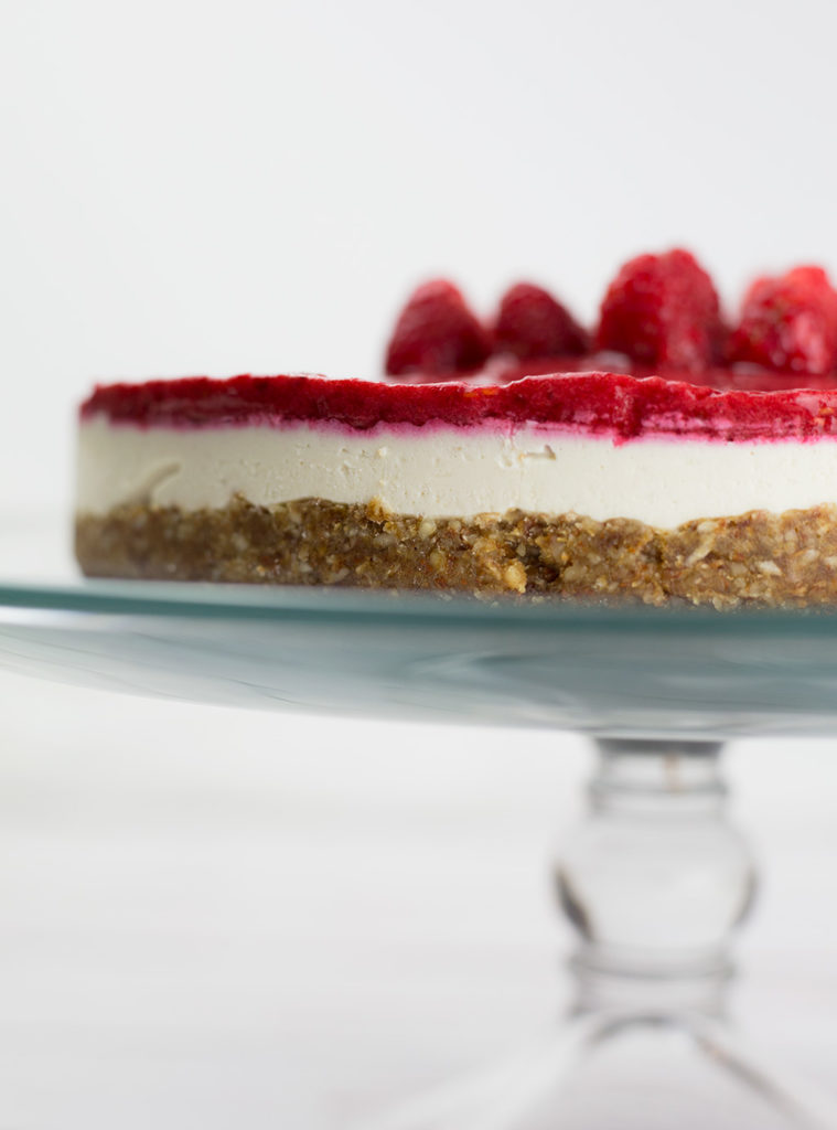 This creamy vegan raspberry cheesecake makes a delightful fresh and fruity dessert and requires no baking. Smooth, creamy, with the right balance of tart and sweet from the raspberries, this dessert is a real crowd pleaser. This raspberry cheesecake is vegan, gluten free, dairy free and paleo.#paleorecipes #vegancheesecake #raspberries #raspberrycheesecake #vegandessert #dairyfree #glutenfreedessert #lowcarbdessert