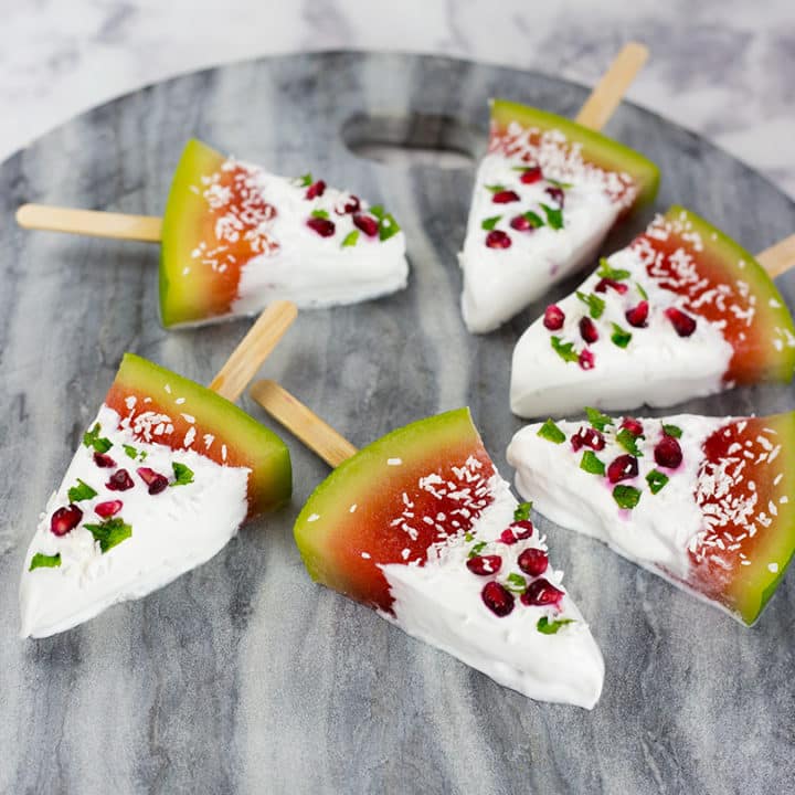 These watermelon coconut popsicles make a fun Christmas treat for the Kiwi or Australian summer. So easy to make, no added sugar or nasties, kids will love these fun and festive summer treats. Paleo, Vegan & Dairy Free. #paleorecipe #popsicles #watermelon #lowcarbrecipes #lowcarbdesserts #veganrecipes #sugarfreerecipes