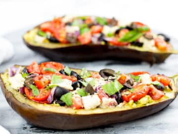 This healthy eggplant bruschetta recipe makes a healthy alternative to your classic bruschetta using delicious baked eggplant as the base. Topped with pesto, Mediterranean style veggies and dollops of cashew cheese this eggplant brucchetta recipe will become a new household favourite. Gluten Free, Paleo, Vegan and Whole 30 compliant.#eggplant #bruschetta #paleorecipes #appetizer #paleo #glutenfreerecipes #dairyfree #grainfree #mediterraneandiet