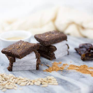 These Carob and Tahini Seed Bars make a healthy snack for kids or adults. Nut free, gluten & dairy Free with no added sugar. These healthy bars have a delicious flavour from the carob without the caffeine hit you can get from cacao or chocolate making them a great kids snack. #paleo #glutenfreerecipes #dairyfree #grainfree #nutfree #healthysnacks #lunchboxideas #allergyfriendly #healthykids