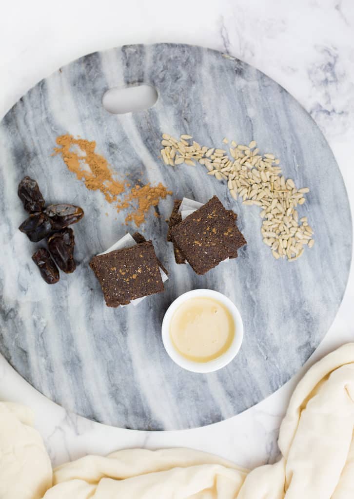 These Carob and Tahini Seed Bars make a healthy snack for kids or adults. Nut free, gluten & dairy Free with no added sugar. These healthy bars have a delicious flavour from the carob without the caffeine hit you can get from cacao or chocolate making them a great kids snack. #paleo #glutenfreerecipes #dairyfree #grainfree #nutfree #healthysnacks #lunchboxideas #allergyfriendly #healthykids