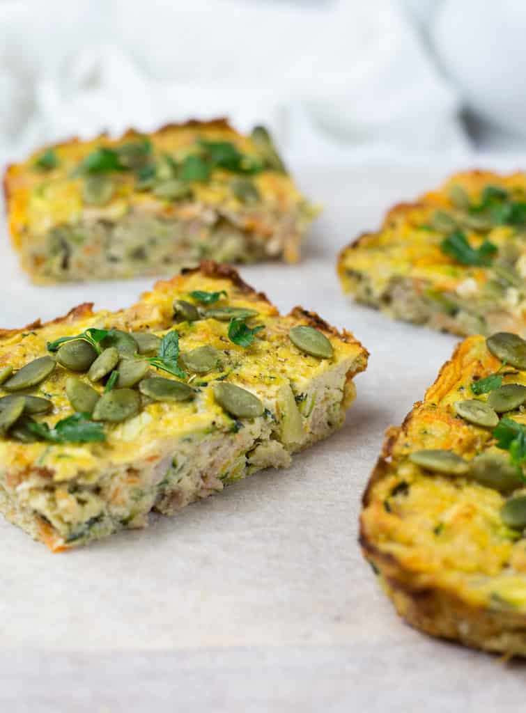 Close up of zucchini and bacon slice on white background.