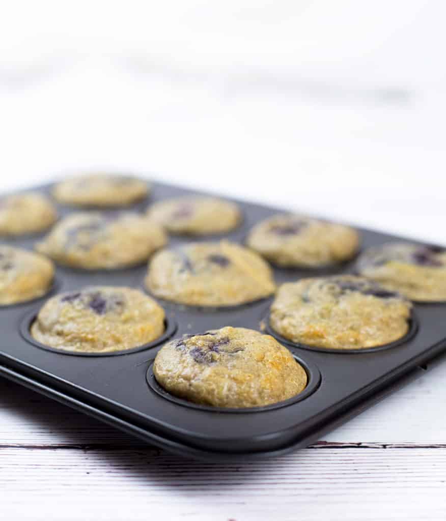 Toddler muffins in baking tray just out of oven.