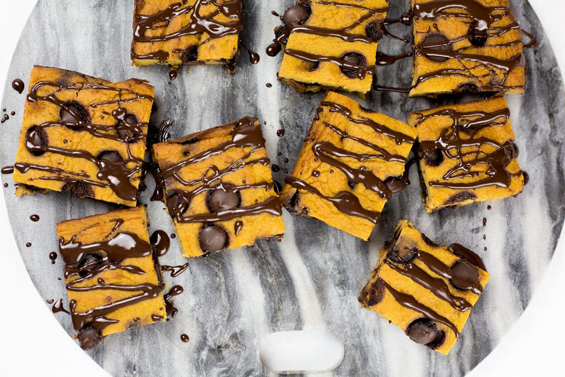 Pumpkin Chocolate Chip Bars on marble background.