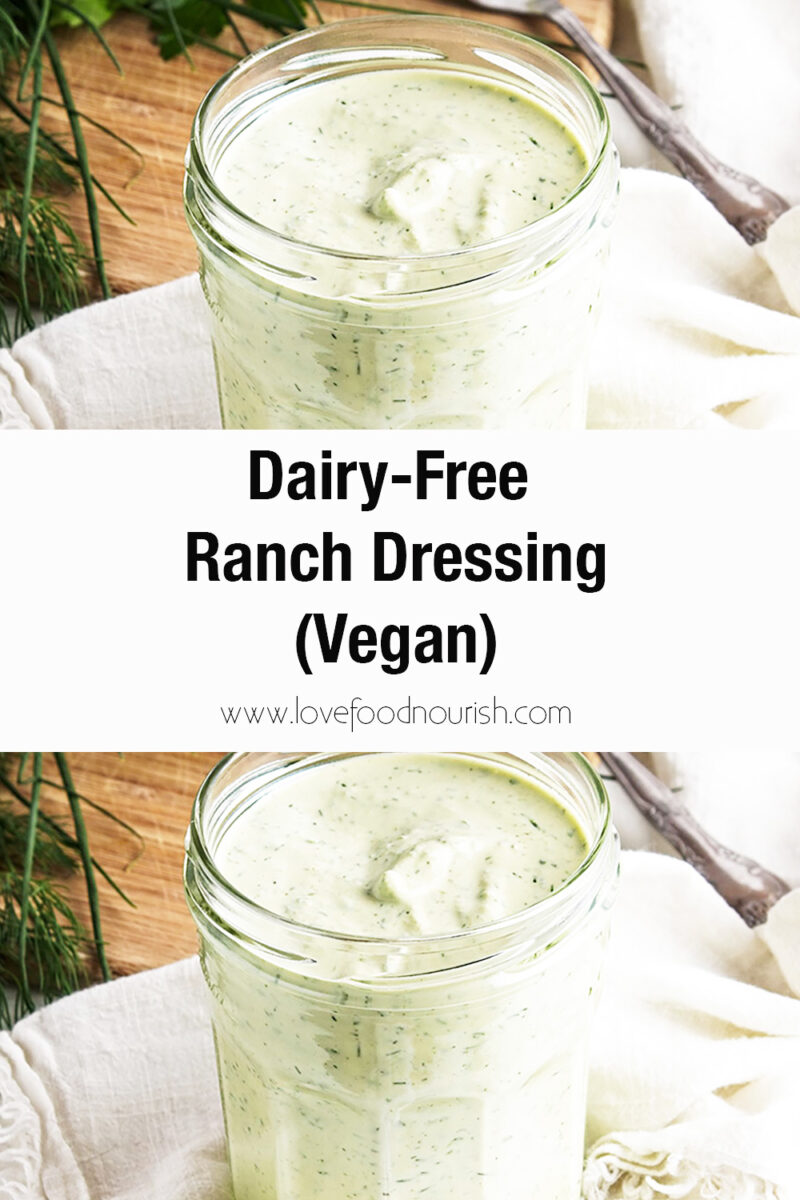 Ranch dressing in glass jar with white cloth and spoon in backrgound.