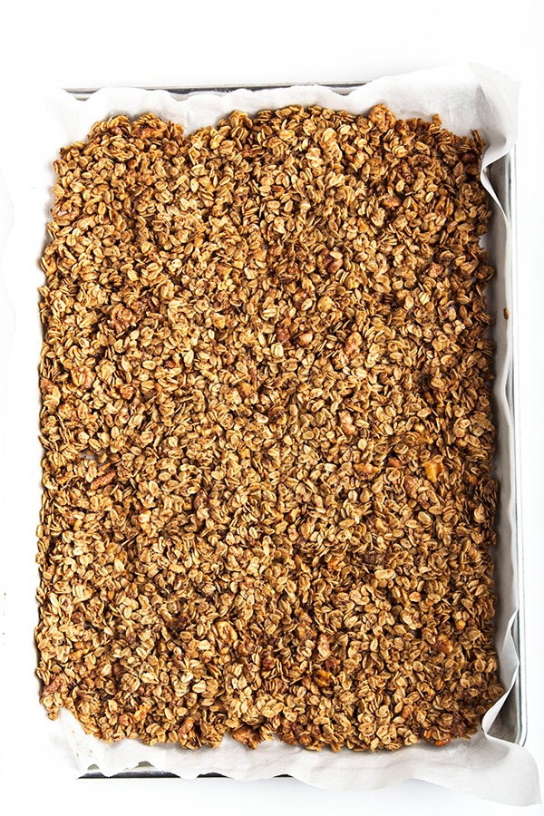 Baked granola mixture in tray.