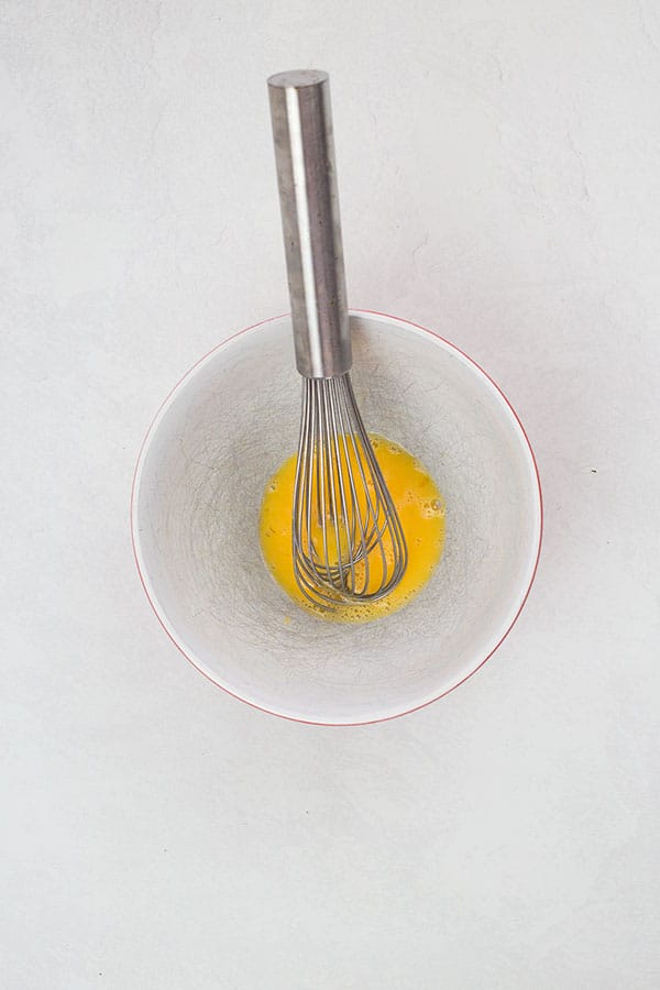 Whisking egg in bowl