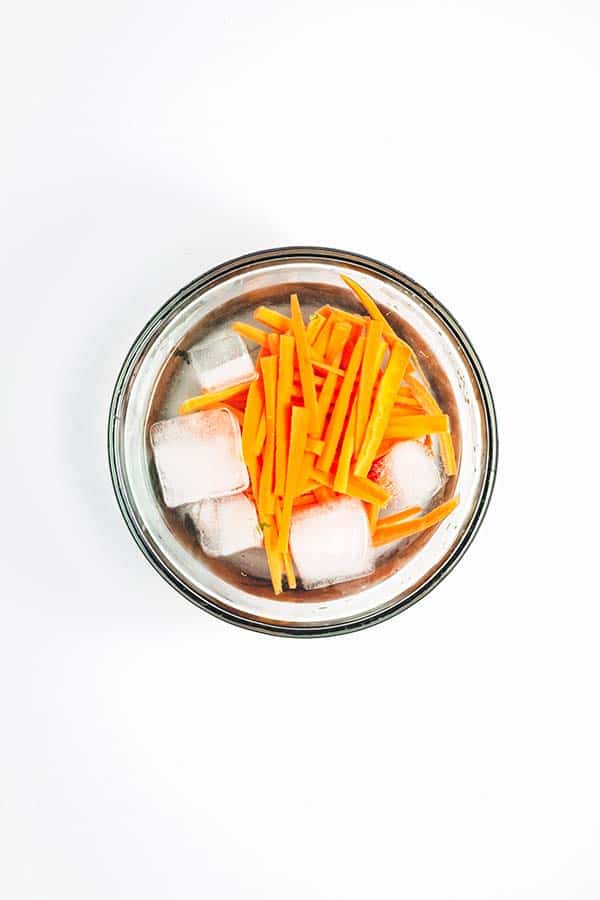 Carrot sticks in ice bowl