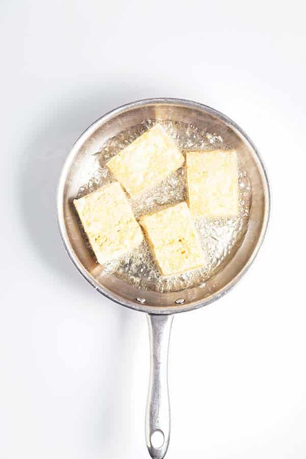 tofu cooking in pan