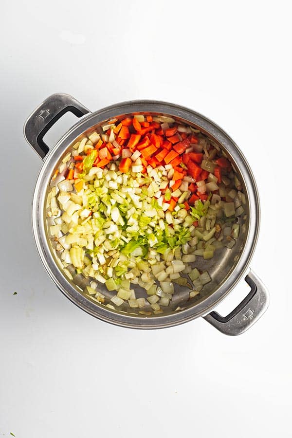 Cooking vegetables for soup in pot
